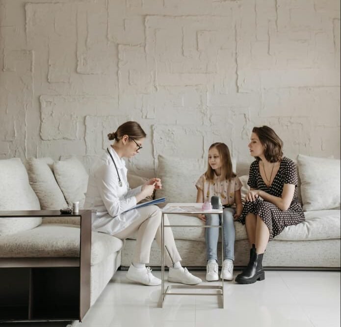 Healthcare professional providing medical care at patient's home